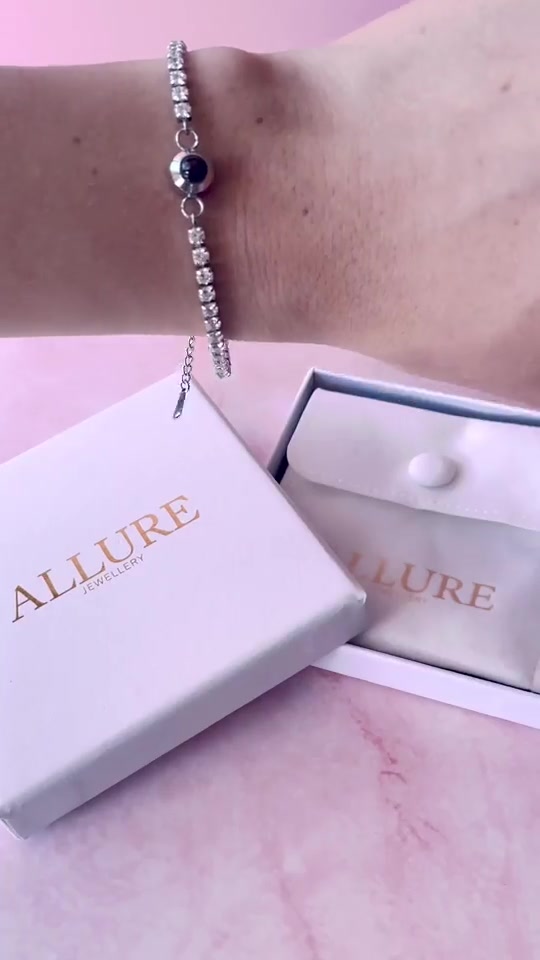 Bracelet and gift boxes on a pink tabletop set